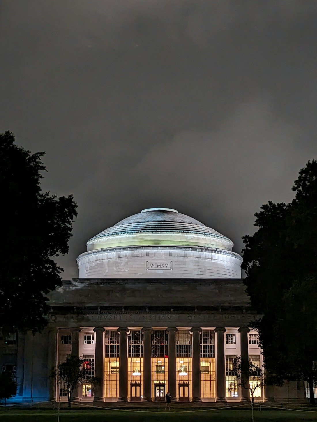 MIT’s Great Dome lit at night.
